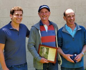 Greg Haas Receives Half Century Plaque from Josiah Haas and Blair Haas at Bud's Summer Picnic